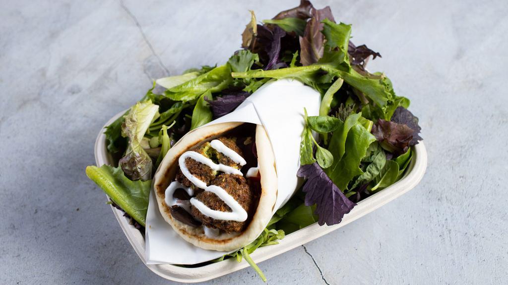 The Vegetarian'S Gyro · Our falafel is made from scratch with garbanzo beans and spices served in hot pita bread. Served with Tomatoes, lettuce onions, green peppers. House-made sauces tzatziki, garlic, and hot sauce.