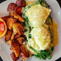 Eggs Florentine · Two poached organic eggs on a scratch made biscuit or English muffin, spinach, tomato and fr...