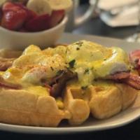 Bacon Waffle Benedict · Two poached eggs, two slices of bacon on a scratch made waffle smothered in house made holla...