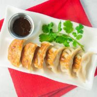 Pot Stickers · Pan-fried pork dumplings known in Chinese simply as 