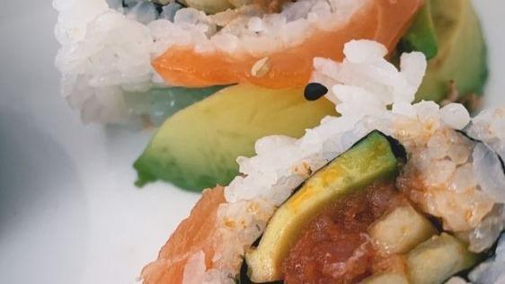 Rainbow Roll · CA roll with tuna, yellowtail, whitefish, salmon, albacore, and avocado on top.