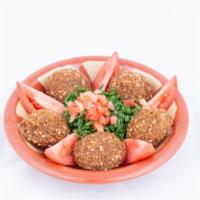 Falafel Appetizer · Ground chick peas mixed with vegetable herbs and garlic, formed into patties, deep fried and...