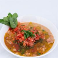 Ful Mudammas · Fava beans stewed with garlic, salt and lemon juice, finished with parsley and extra virgin ...