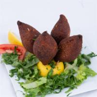 Fried Kibbeh (1Pc) · A classic combination of lamb, beef and bulgur wheat shell, stuffed with a filling of precoo...