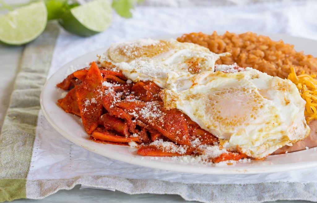 Chilaquiles · Red or Green Chilaquiles topped with grilled onion, queso fresco, and an egg. Served with Rice & Beans