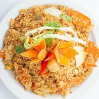 Pineapple Fried Rice · Fried rice, eggs, carrots & onions, mixed to perfection with your choice of chicken, beef, o...