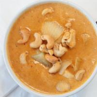 Massaman Curry (Gluten-Free) · A delicious peanuty taste to your curry, topped off with cashews. Your choice of chicken, be...