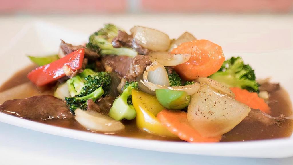 Beef & Broccoli · Tender marinated steak stir fried with broccoli, carrot, & onions.