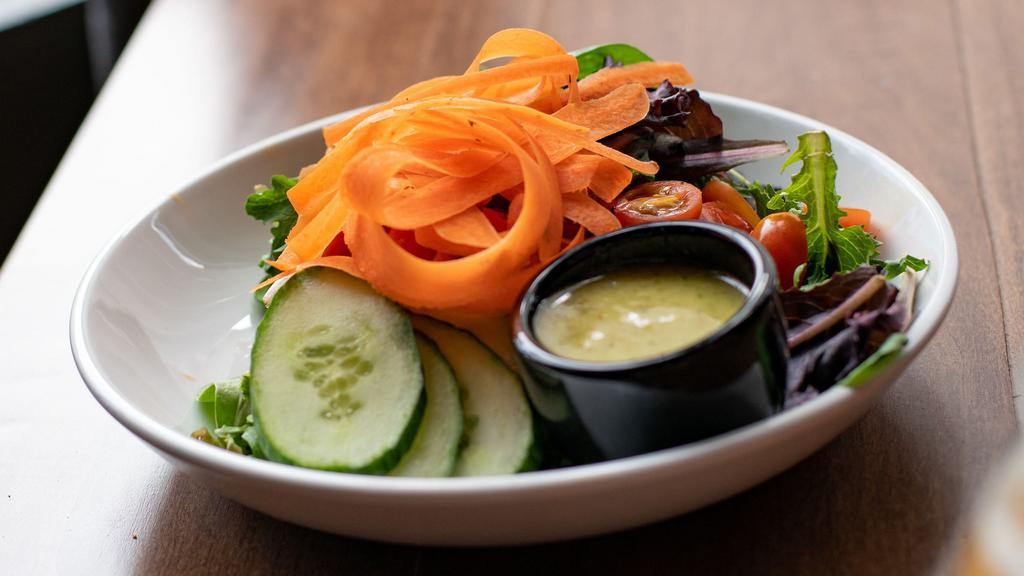 House Salad · Vegan, gluten-free. greens, tomatoes, cucumbers, shaved carrots, pickled red onion.