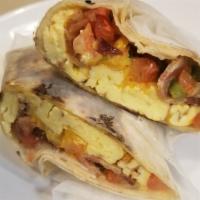 Classic Burrito · rice, beans, pico de gallo, fajita veggies, corn, and cheddar cheese melted on a grandee tor...