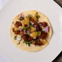 Al Pastor · marinated grilled pork topped with fresh pineapple, red onion and cilantro