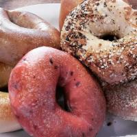 Egg A Bagel Pile Up · Your choice of bagel or bialy schmeared with plain cream cheese piled high with two eggs, ha...
