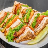 Triple Decker Sandwich · Turkey, bacon, lettuce, tomato & mayo on toasted wheat bread.