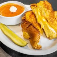 Grilled Cheese Stack And Tomato Soup · Thick house made challah stuffed with cheddar, american and pepper jack cheeses and grilled ...
