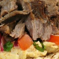 Beef Shawarma Wrap · Tender beef with hummus, lettuce, tomato, and red onion drizzled with your choice of sauce a...