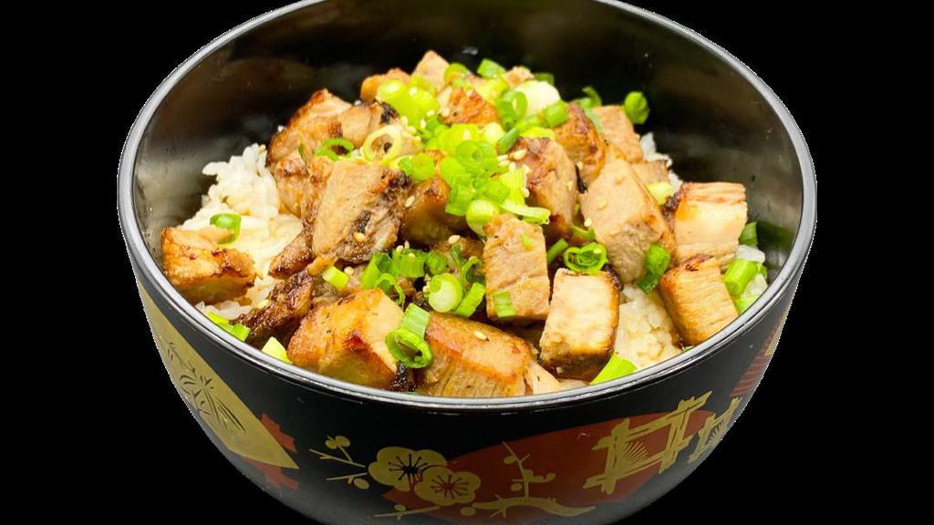 Pork Chashu Don · Chopped chashu pork served over white rice. Topped with chashu sauce, green onion and sesame seeds.