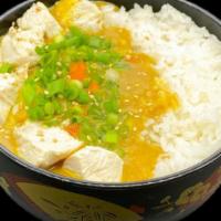 Chicken Curry Rice · House-made yellow curry mixed with chicken, potatoes,
onions, and carrots then topped with g...
