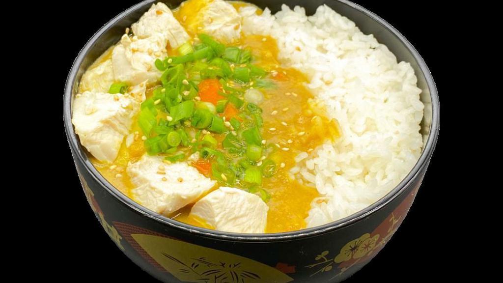 Chicken Curry Rice · House-made yellow curry mixed with chicken, potatoes,
onions, and carrots then topped with green onion and sesame seeds. Served with steamed rice.