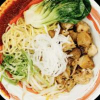 Spicy Dry Noodle · Dry noodle with chopped pork and veggie topping. Served with spicy peanut and sesame sauce o...