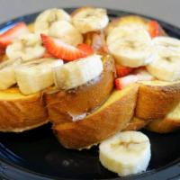 Tropical French Toast · French toast, bananas and strawberries.
