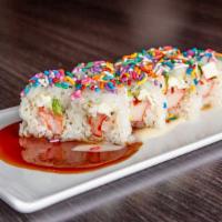 Pastel · In: crab stick, avocado, cream cheese, top: rainbow sprinkle, sauce: eel sauce, yum yum sauce.