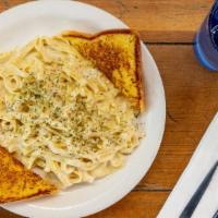Fettuccine Alfredo · Fettuccine noodles with a rich and creamy Alfredo sauce. Parmesan topped served with grilled...