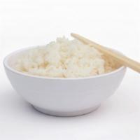 Arroz/Rice · Our fluffy rice cooked with our special blend of seasonings.