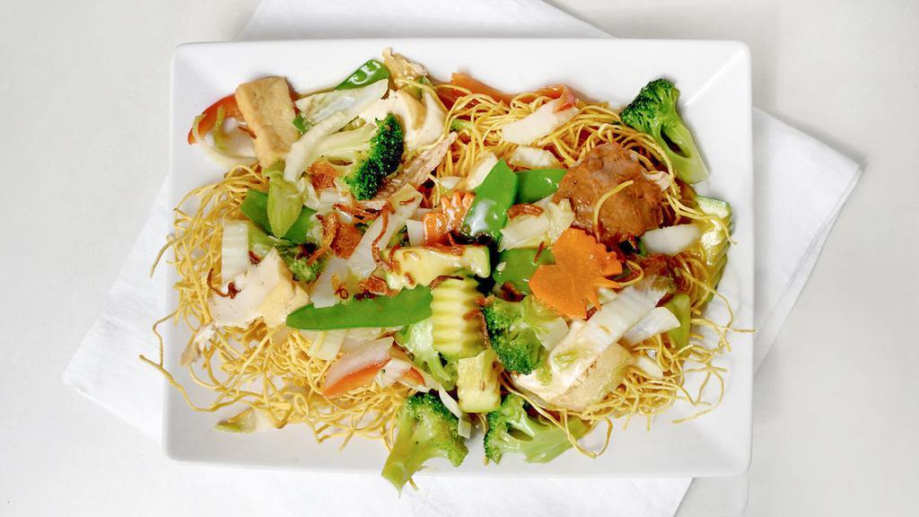 Pan Fried Noodles (Phở Áp Chảo) · Fresh stir-fried veggies, tofu, soy protein, mushroom & onion atop a crispy crush of pan-fried rice noodles. (GFO)