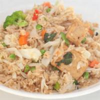 Veggie Fried Rice · Stir-fry rice with broccolis, peas, diced carrots, tofu, & soy protein. (GFO)