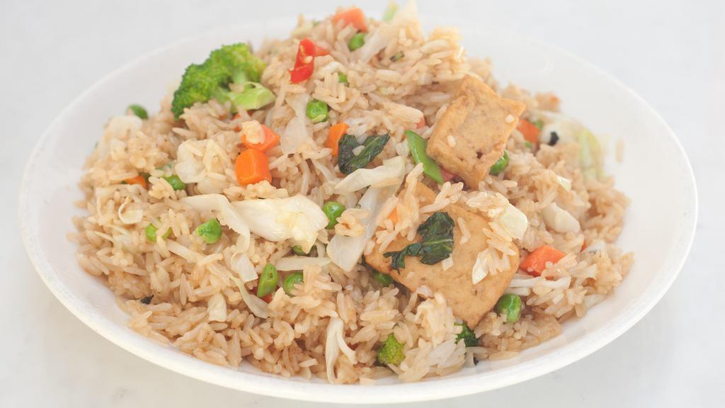 Veggie Fried Rice · Stir-fry rice with broccolis, peas, diced carrots, tofu, & soy protein. (GFO)