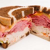 Carnegie Hall Sandwich · Hot. Pastrami, turkey, swiss, coleslaw, and Russian dressing on rye.