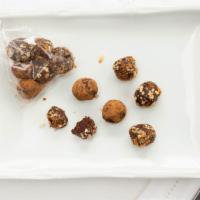 Chocolate Energy Truffles · Made with medjool dates and almond milk. Rolled in toasted almonds, cacao powder and toasted...