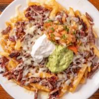 Carne Asada Fries · New. Crispy French fries topped with mesquite-grilled steak and topped with melted Monterey ...
