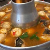 Tom Yum · Spicy and sour soup, mushroom, tomato, galangal, kaffir lime leaves, lemongrass, cilantro an...