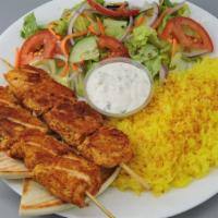 Chicken Kabob · Includes salad, lemon rice, pita bread, tzatziki, and Greek dressing.