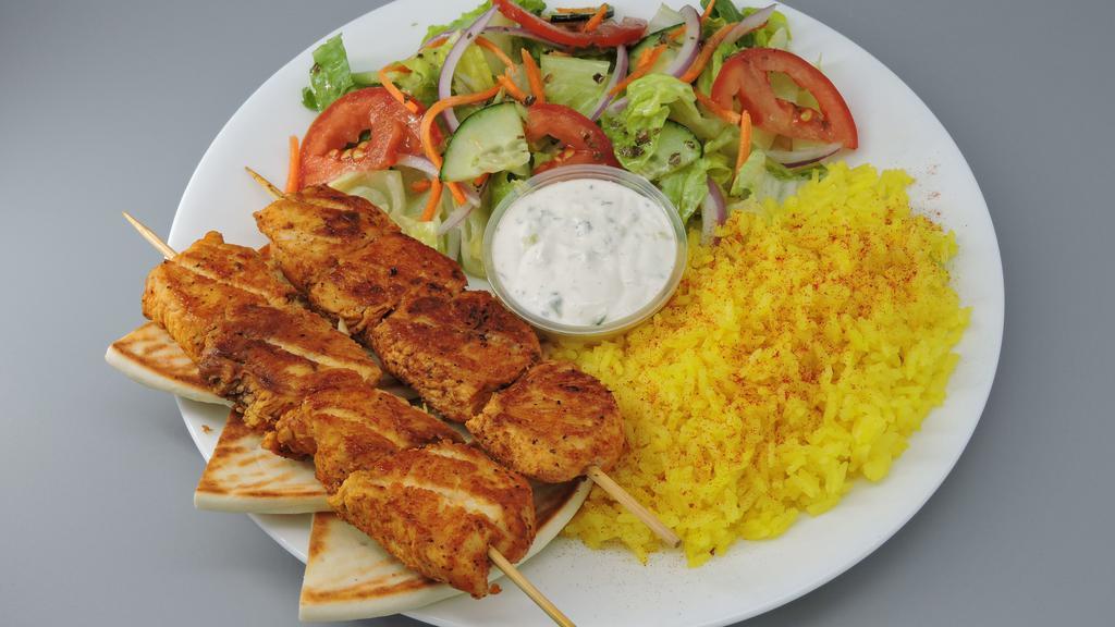 Chicken Kabob · Includes salad, lemon rice, pita bread, tzatziki, and Greek dressing.