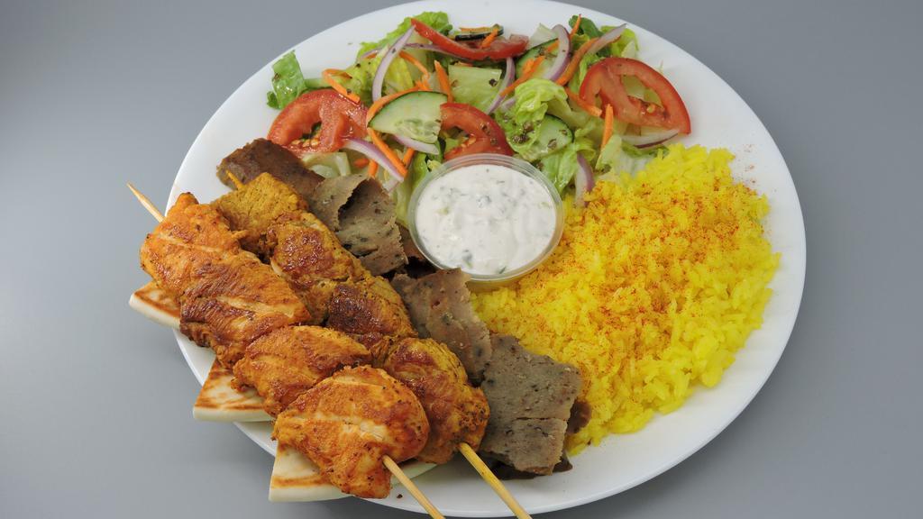 Chicken, Pork & Gyro · Includes salad, lemon rice, pita bread, tzatziki, and Greek dressing.