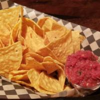 Chips & Salsa · restaurant style tortilla chips served with a side of homemade salsa.