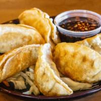 Crispy Potstickers (6 Pcs.) · Northern Chinese style fried dumpling stuffed with juicy ground pork and vegetables.