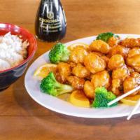 Orange Peel Chicken · Breaded chicken  in a tangy orange sauce. Served with broccoli.