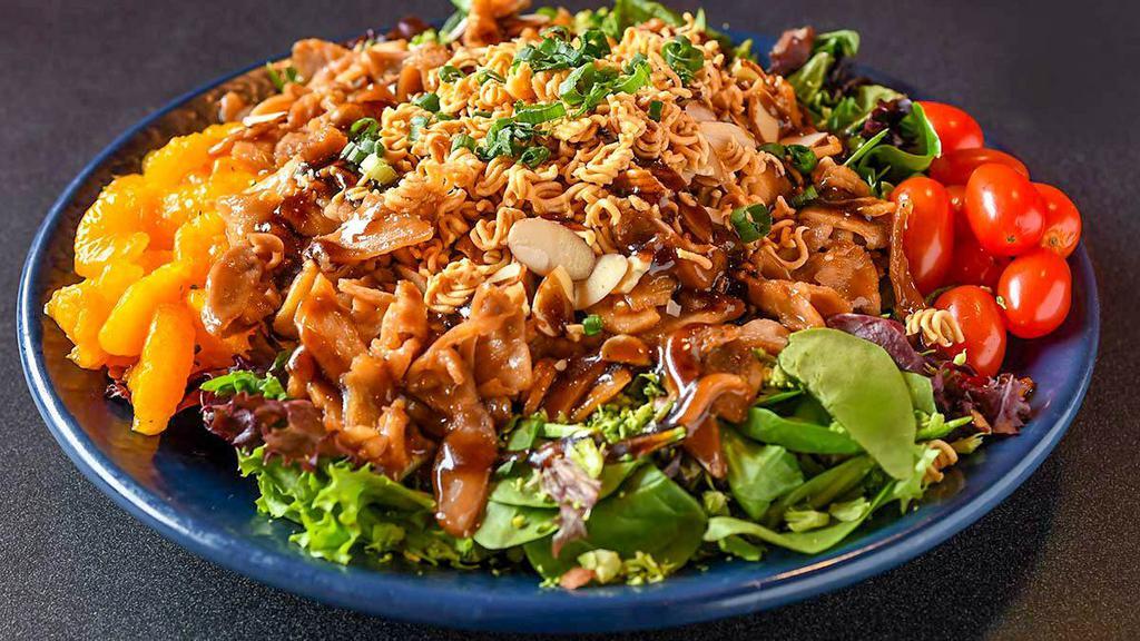 Chicken Teriyaki Salad · Mixed greens topped with teriyaki chicken, toasted noodles, almonds, tomatoes, mandarin oranges, broccoli, scallion and our sweet Asian vinaigrette.