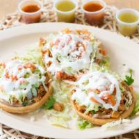 Sopes · Comes with beans, choice of meat, cilantro, onions, salsa, lettuce, sour cream, tomato, and ...