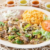 Machaca · Pork meat cooked with bell pepper, tomatoes, onions and eggs. Served with a side or rice, be...