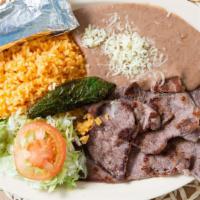 Carne Asada · 2-3 thin sliced beef steak meat. Served with a side of rice, beans, lettuce, tomato, fried j...