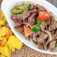 Lega Tibes · Chunks of lamb sauteed with onion, jalapeno pepper, butter and other spices.