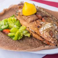 Fried Fish · Deep fried croaker fish, served with veggies and salad.