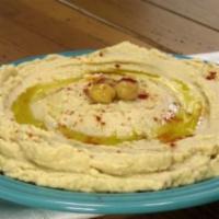 Hummus · A puree chickpea with tahini, garlic, olive oil and lemon juice served with hot bread