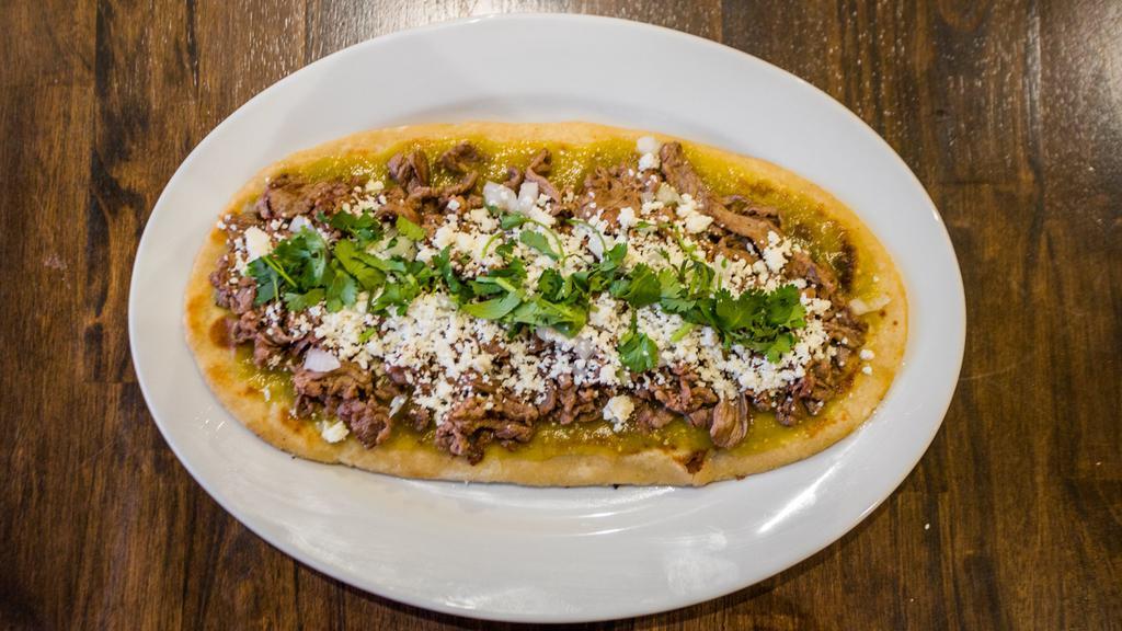 Huarache Especial/Special · 13'' inch long tlaxcalli filled with beans, finished with onion, cilantro, queso fresco and salsa of your choice; ADD meat/topping of your choice.