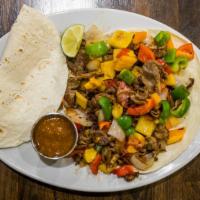 Alambre · Thoroughly cooked and seasoned steak and bacon with bell peppers, sautéed in onion and garli...
