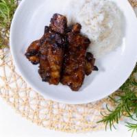 Teriyaki Spare Ribs With Rice · Fall of the bone spare ribs cooked in homemade teriyaki sauce served with a bed of white rice.